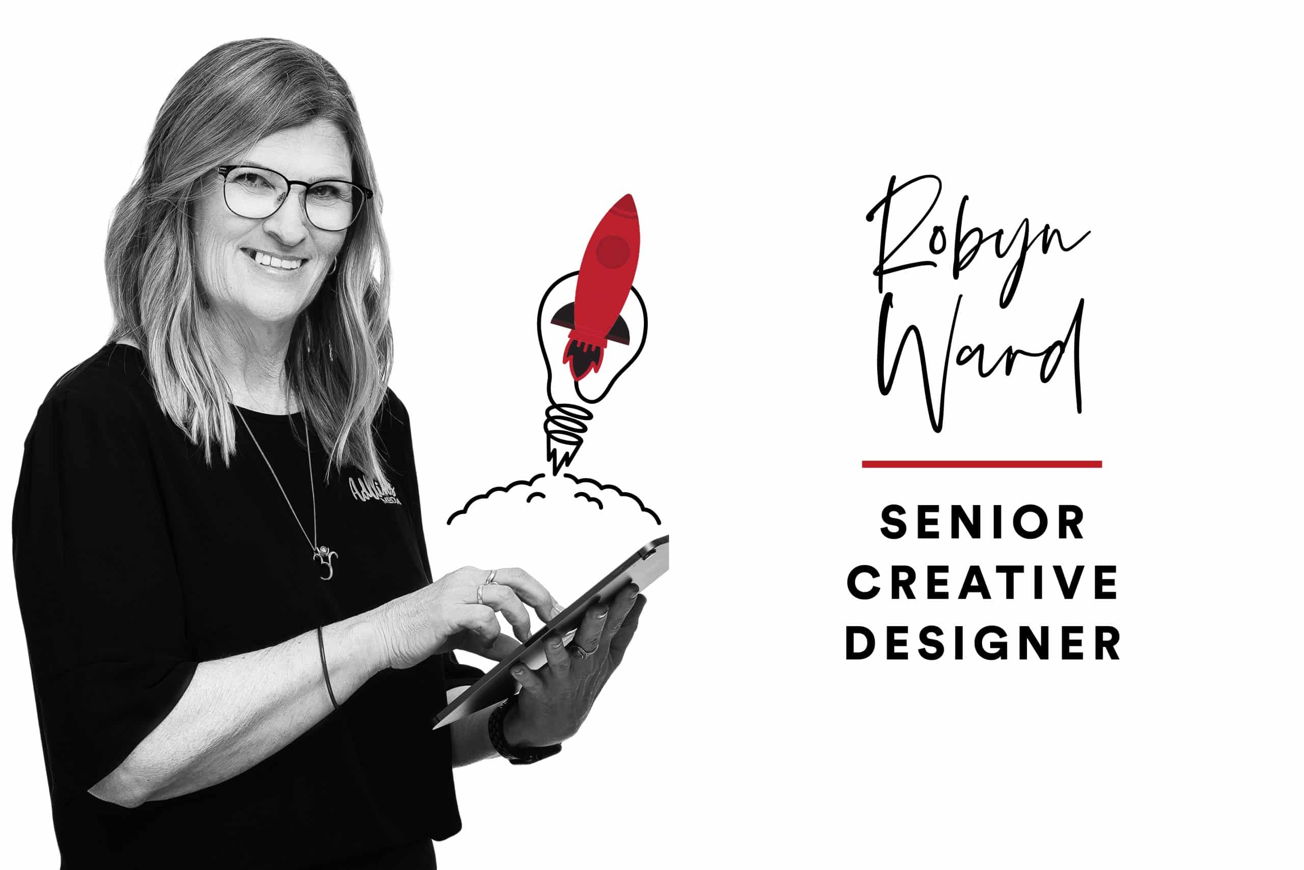 Senior Creative Designer Robyn Ward holds a tablet and smiles at the camera.